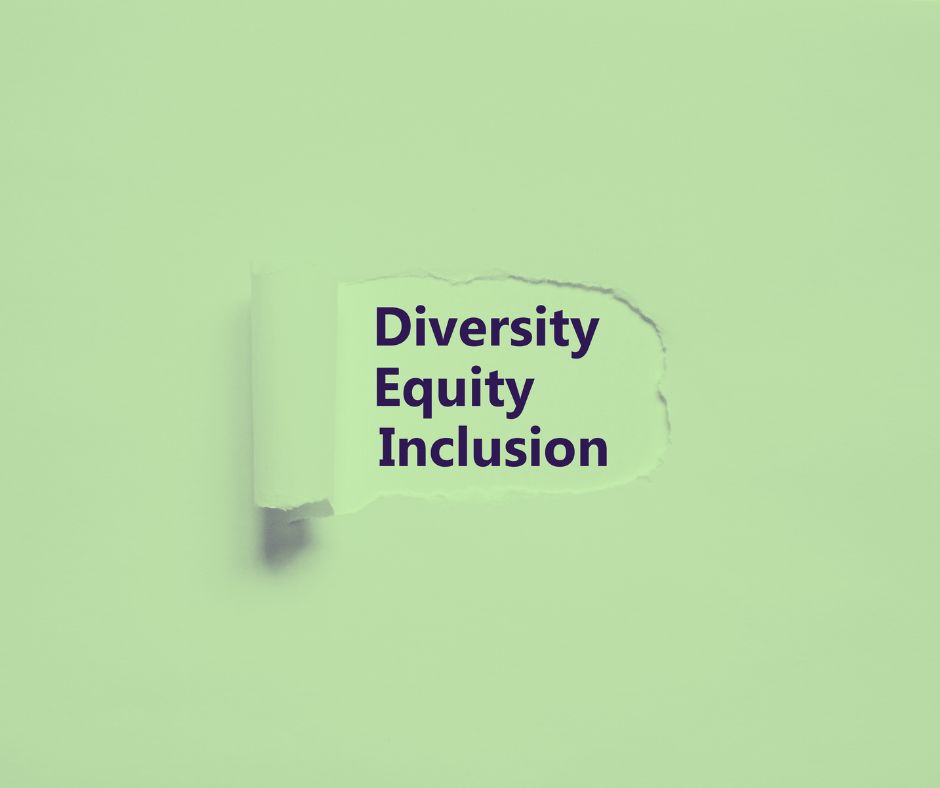 green tinted paper scratched back to reveal the words Diversity, Equity, and Inclusion