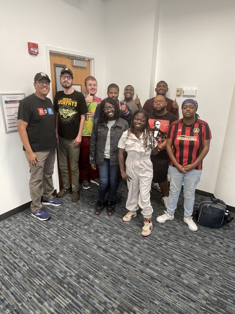 Tim standing with students from the IDEAL program